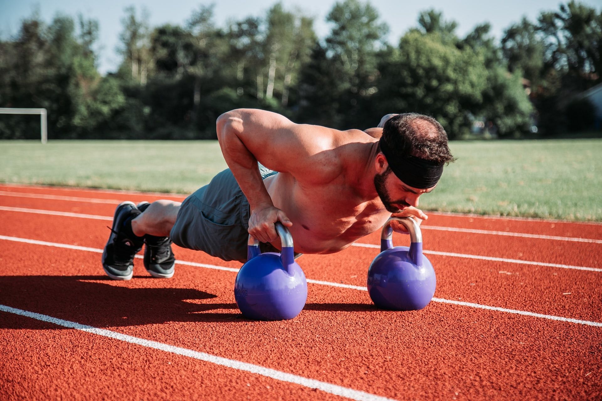 Should you work out when sore? (Photo via Unsplash/Alora Griffiths)